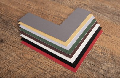 A photo of a selection of picture mount chevrons in a variety of different colours