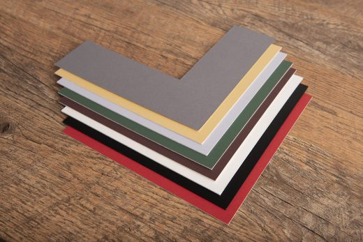 A photo of a selection of picture mount chevrons in a variety of different colours